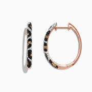 A pair of 14K rose gold hoop earrings featuring leopard spots and 0.78 TCW diamonds in black, brown, and white, set against a white background.