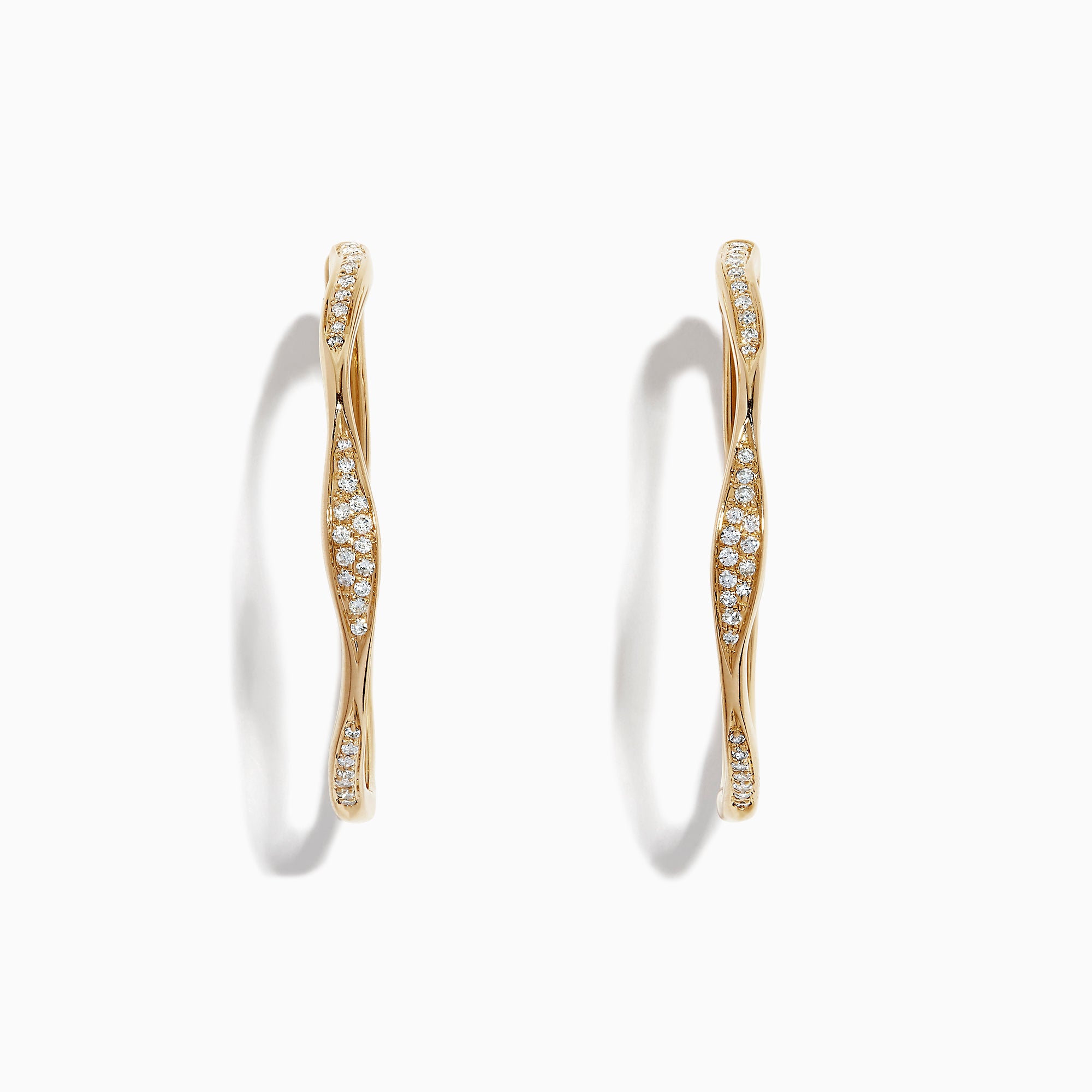 A pair of DOro 14K Yellow Gold 1 1/4 Diamond Wave Hoop Earrings, 0.25 TCW, with a twisted design and white diamonds along the front, displayed on a white background.