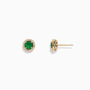 The Brasilica 14K Yellow Gold Emerald and Diamond Stud Earrings (1.08 TCW) feature round emerald centers encircled by a halo of clear diamonds, shown against a plain white background.