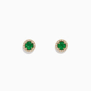 The Brasilica 14K Yellow Gold Emerald and Diamond Stud Earrings (1.08 TCW) feature round emerald centers encircled by a halo of clear diamonds, shown against a plain white background.