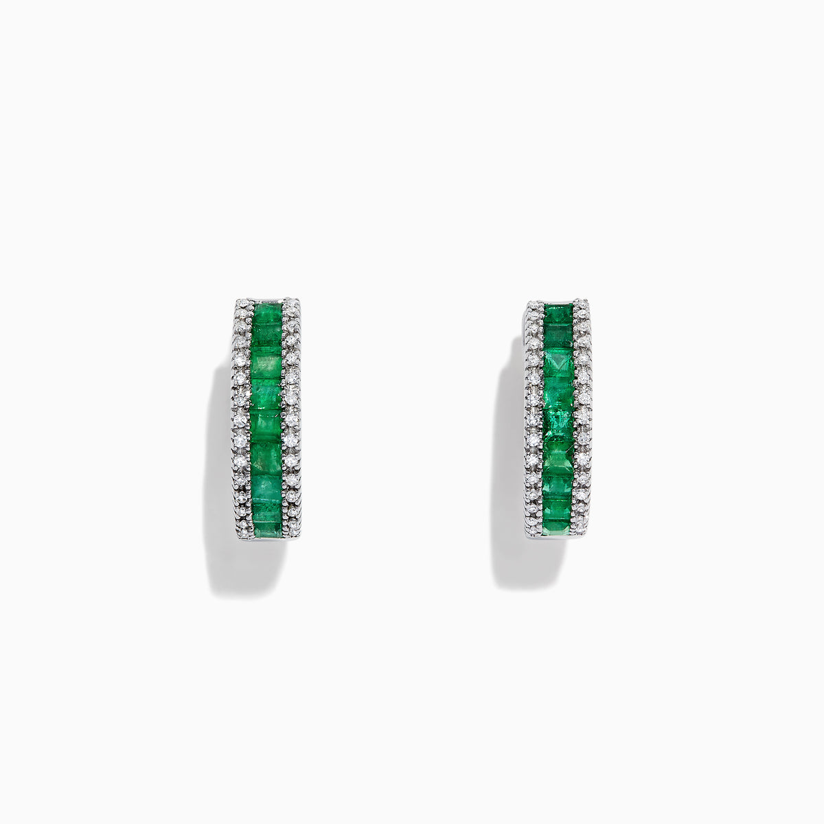 The Brasilica 14K White Gold Emerald and Diamond Hoop Earrings, 2.04 TCW, feature a central row of green emeralds bordered by white diamonds, all set in white gold and displayed against a white background.