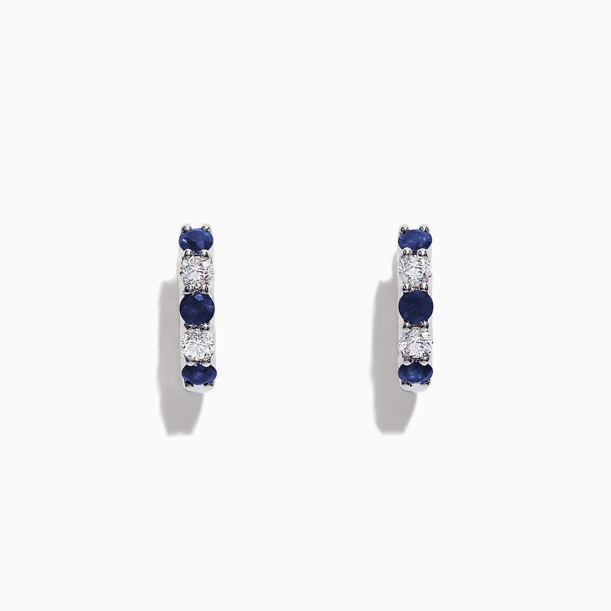The Royale Bleu 14K Gold Sapphire and Diamond Hoop Earrings (1.19 TCW) feature alternating round sapphires and diamonds set in white gold, shown against a plain white background.
