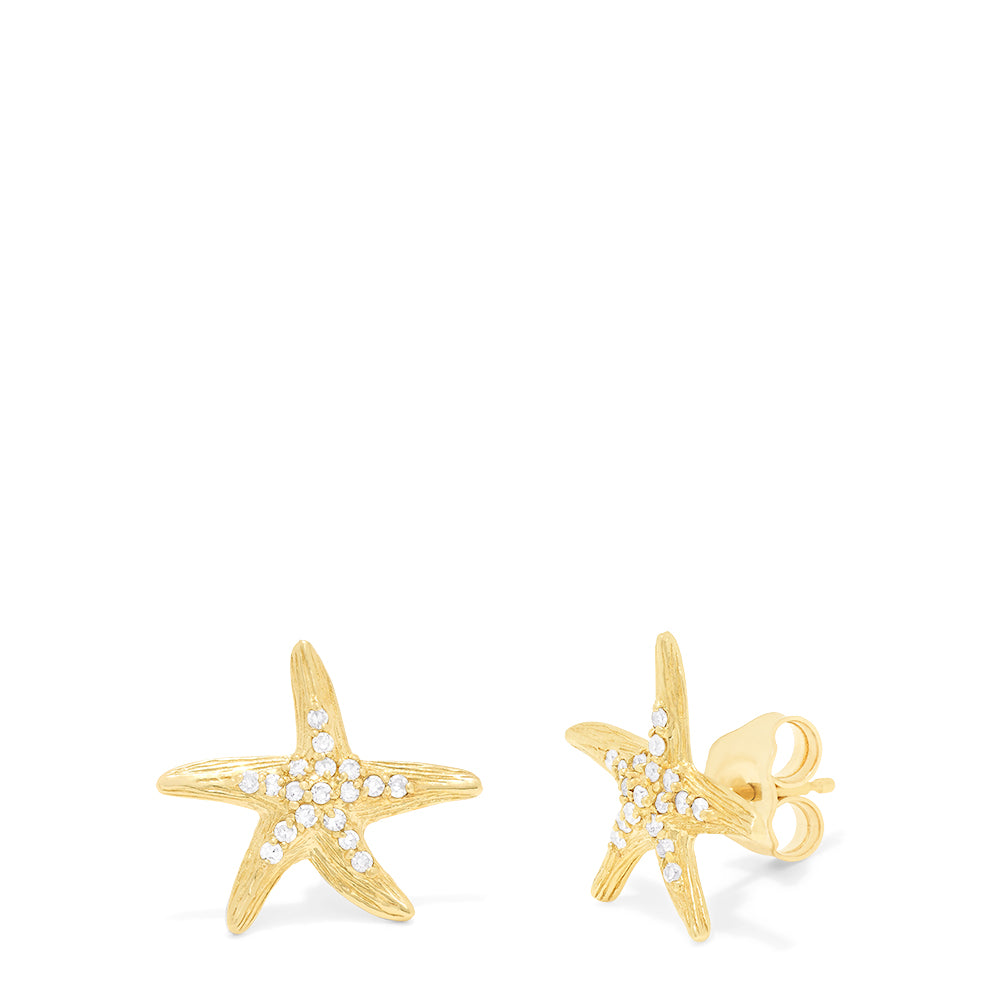 A pair of Seaside 14K Yellow Gold Diamond Starfish Earrings, 0.18 TCW, are shown against a plain white background, each arm sparkling with small diamonds.