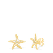 A pair of Seaside 14K Yellow Gold Diamond Starfish Earrings, 0.18 TCW, are shown against a plain white background, each arm sparkling with small diamonds.