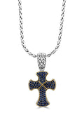 Sterling Silver & 18K Gold Blue Sapphire Cross Pendant, 0.88 TCW features an ornate cross with rounded edges, gold accents, blue sapphires, and detailed bail on a sterling silver chain necklace.