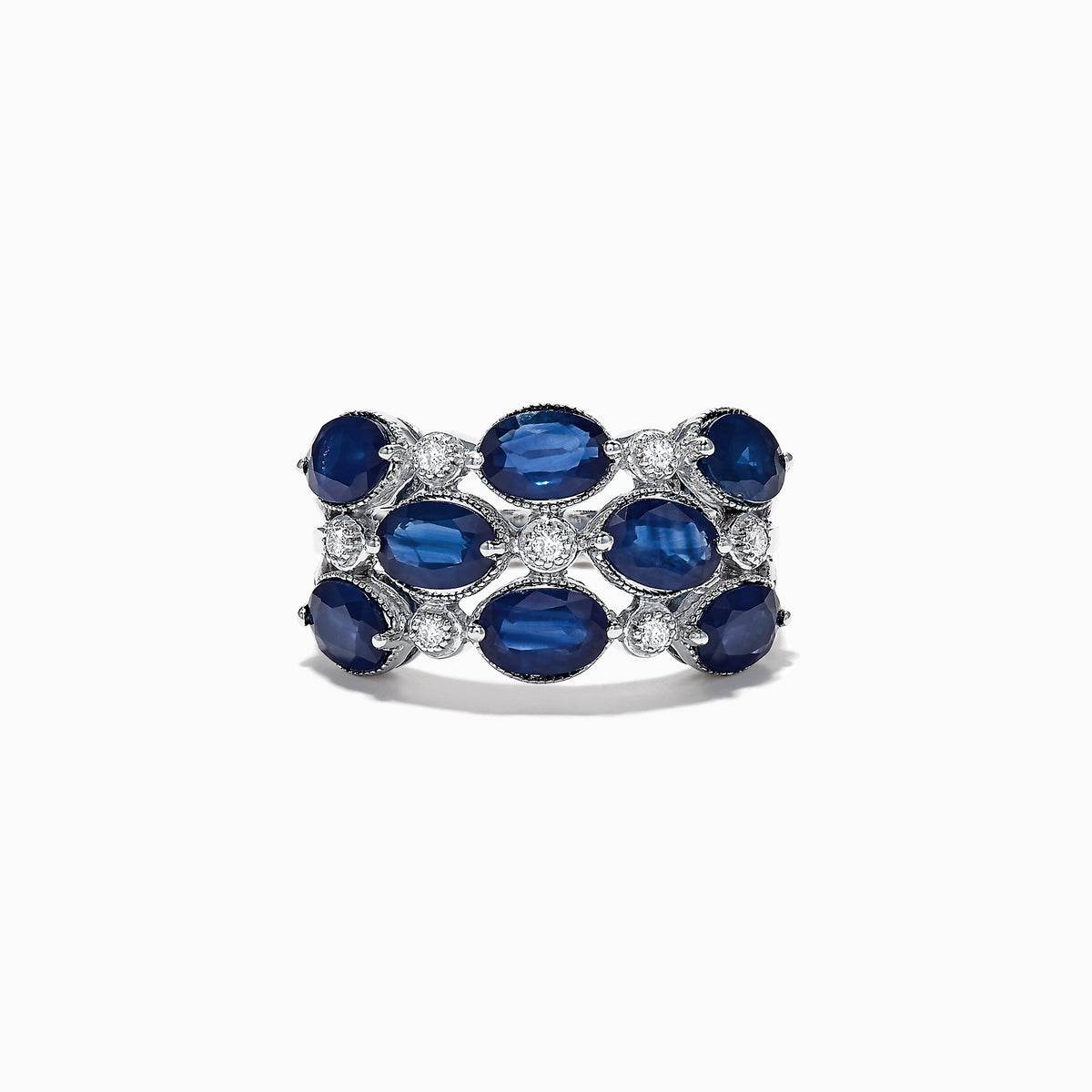 This elegant 14K white gold ring features alternating oval blue sapphires and round white diamonds, totaling 4.66 carats, for a striking look.