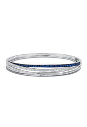 The Royale Bleu 14K White Gold Blue Sapphire & Diamond Bangle features a single row of blue sapphires and diamonds, totaling 1.47 TCW, set along the center for sleek elegance.