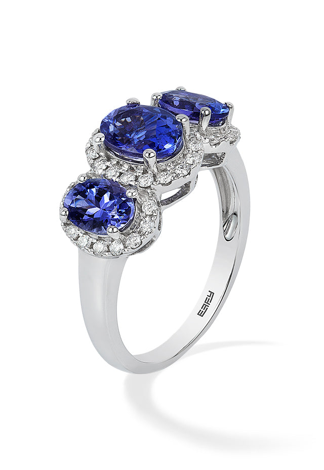 A 14K white gold ring showcasing three oval-cut tanzanites, each encircled by sparkling diamonds, with a total carat weight of 2.35.
