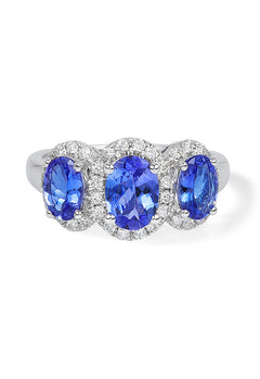 A 14K white gold ring showcasing three oval-cut tanzanites, each encircled by sparkling diamonds, with a total carat weight of 2.35.