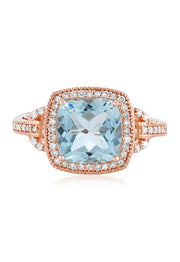 The Aquarius 14K Rose Gold Aquamarine and Diamond Ring, 3.10 TCW, showcases a cushion-cut aquamarine center, haloed by sparkling white diamonds and detailed band accents for an elegant finish.