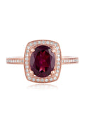 The Bordeaux 14K Rose Gold Rhodolite Garnet and Diamond Ring, 2.48 TCW showcases a large oval rhodolite garnet, double haloed by white diamonds, with additional diamond accents along the band.