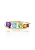 The Mosaic 14K Yellow Gold Multi Gemstone Ring, 1.33 TCW, showcases five vibrant round gemstones—purple, blue, green, yellow, and red—set in a row across the top.