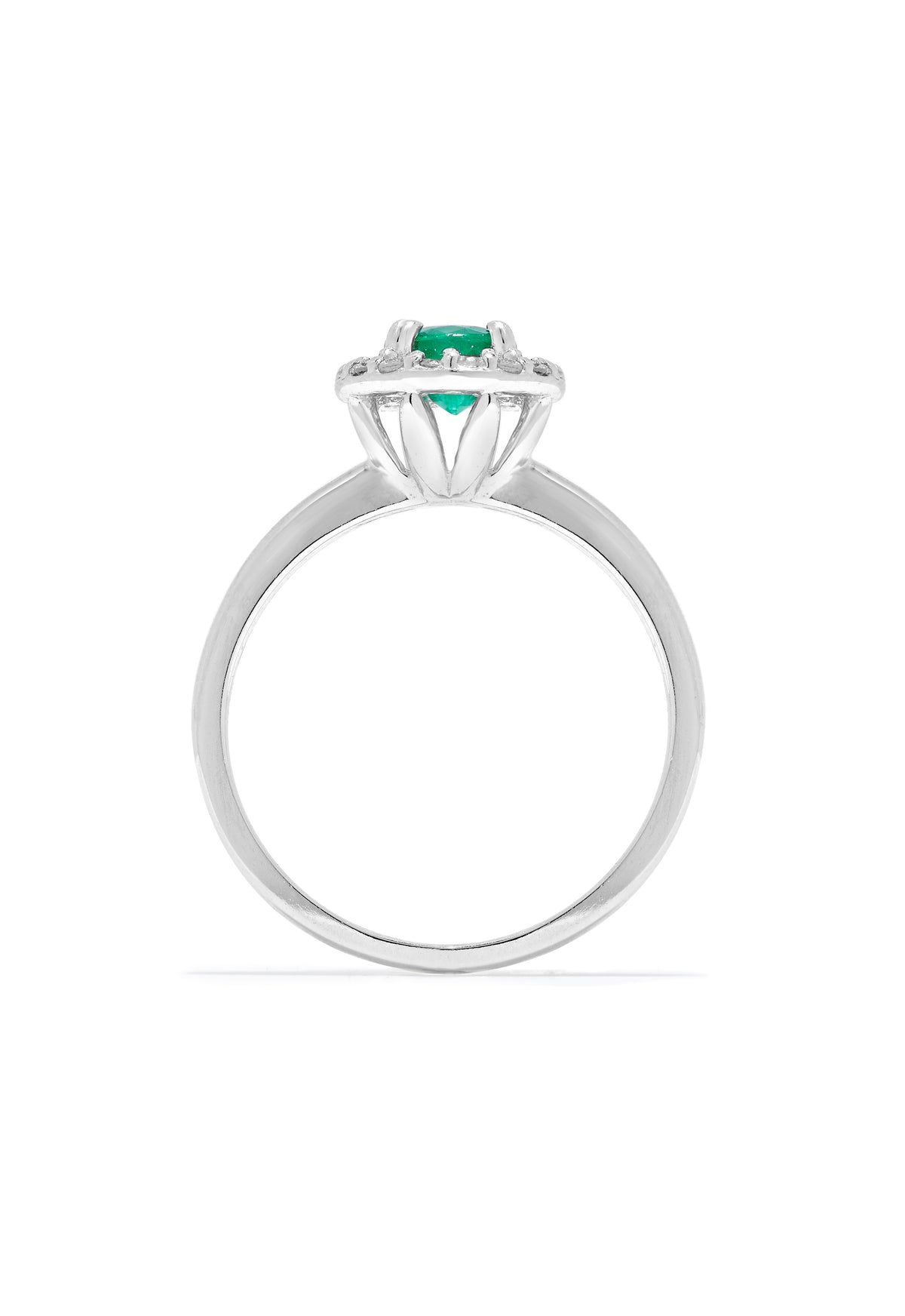 The Brasilica 14K White Gold Emerald and Diamond Halo Ring, 0.60 TCW, features a round green emerald centered in a halo of sparkling white diamonds, presented against a white background.