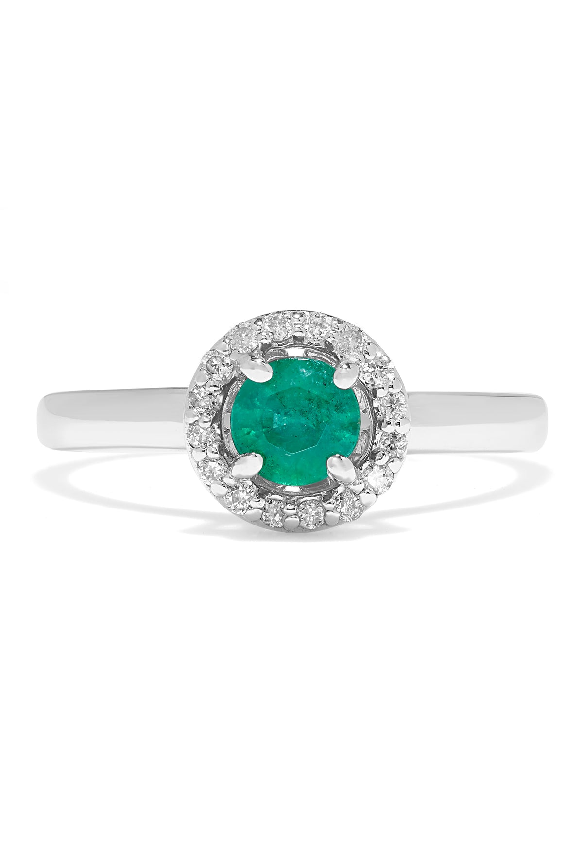The Brasilica 14K White Gold Emerald and Diamond Halo Ring, 0.60 TCW, features a round green emerald centered in a halo of sparkling white diamonds, presented against a white background.