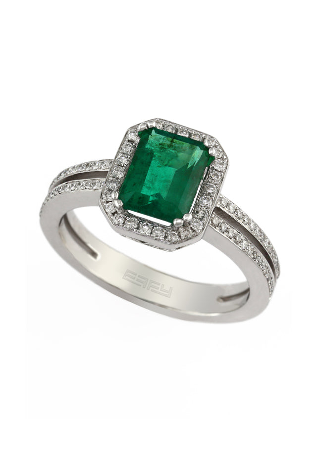 The Brasilica 14K White Gold Emerald and Diamond Ring, 1.70 TCW, features a rectangular green emerald centerpiece framed by diamonds and a split shank band adorned with dazzling diamonds.