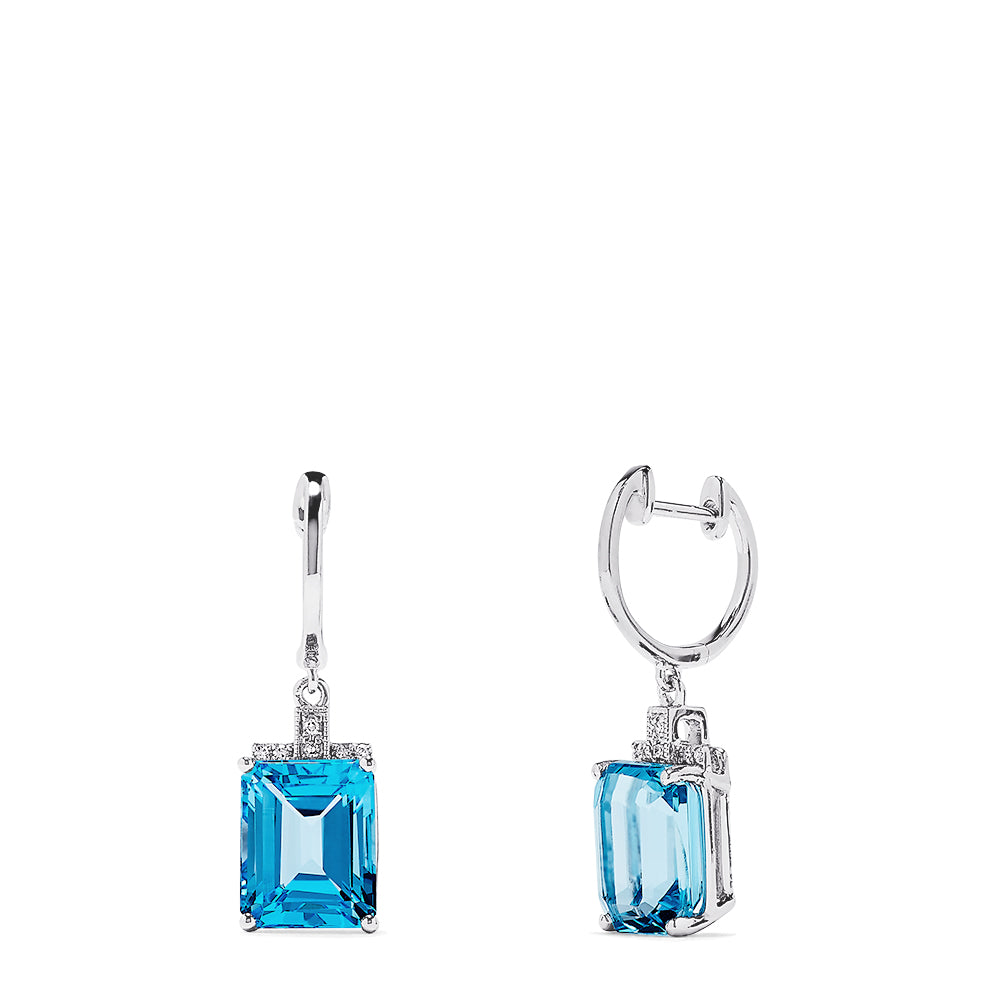 The 14K White Gold Emerald Cut Blue Topaz and Diamond Drop Earrings, 9.25 TCW, feature emerald-cut blue topaz gems in elegant frames with diamond accents and classic simple hooks for a timeless look.