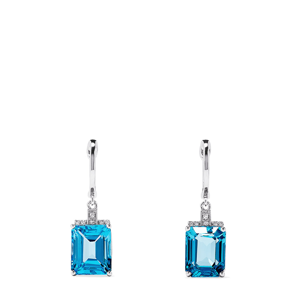 The 14K White Gold Emerald Cut Blue Topaz and Diamond Drop Earrings, 9.25 TCW, feature emerald-cut blue topaz gems in elegant frames with diamond accents and classic simple hooks for a timeless look.