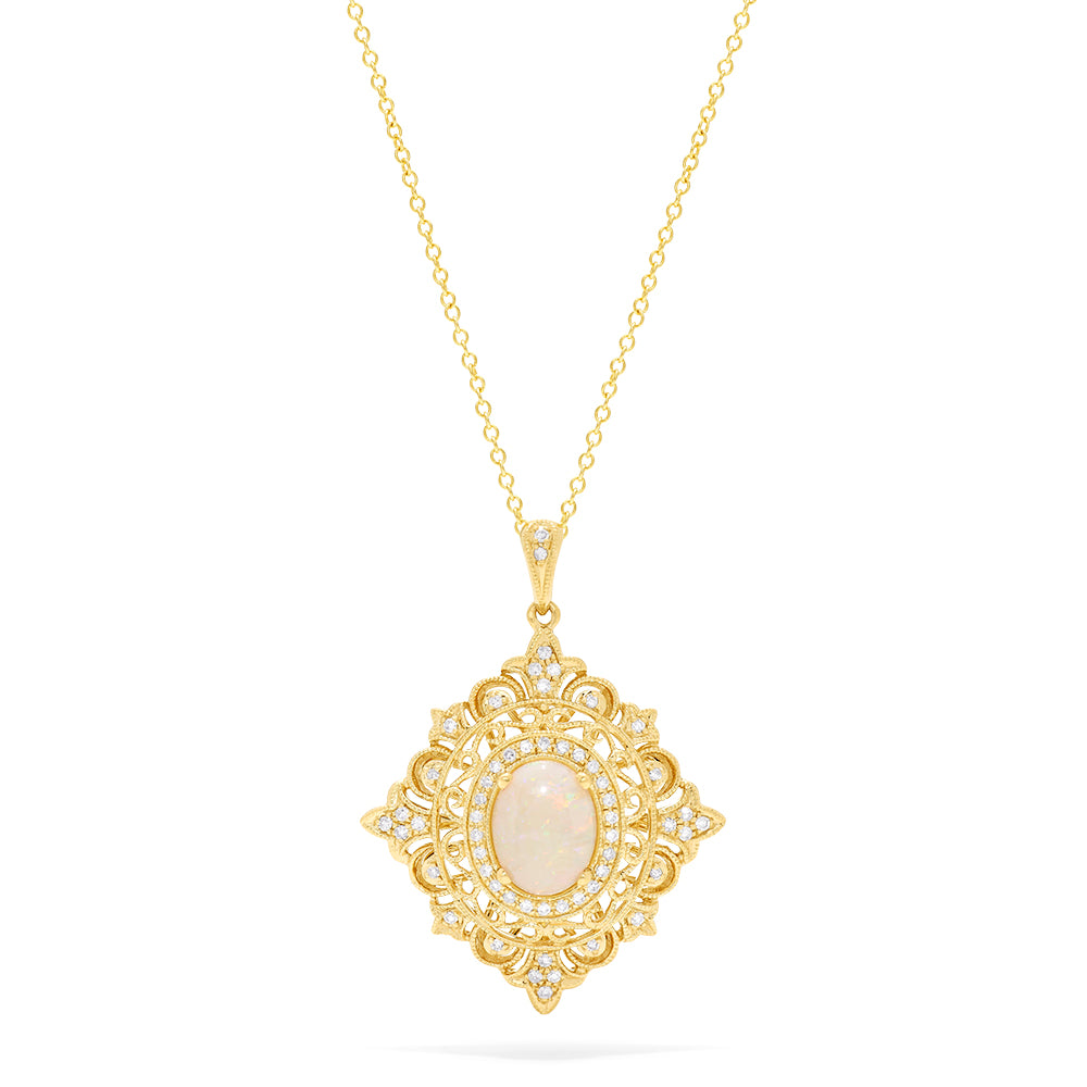 The Aurora 14K Yellow Gold Opal and Diamond Pendant features an ornate, vintage-inspired design with a central oval opal, delicate filigree detailing, and sparkling diamond accents, totaling 1.24 carats.