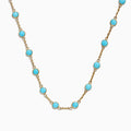 The 14K Yellow Gold Turquoise Necklace, 7.75 TCW, showcases evenly spaced round turquoise stones set in yellow gold bezels, displayed on a white background.