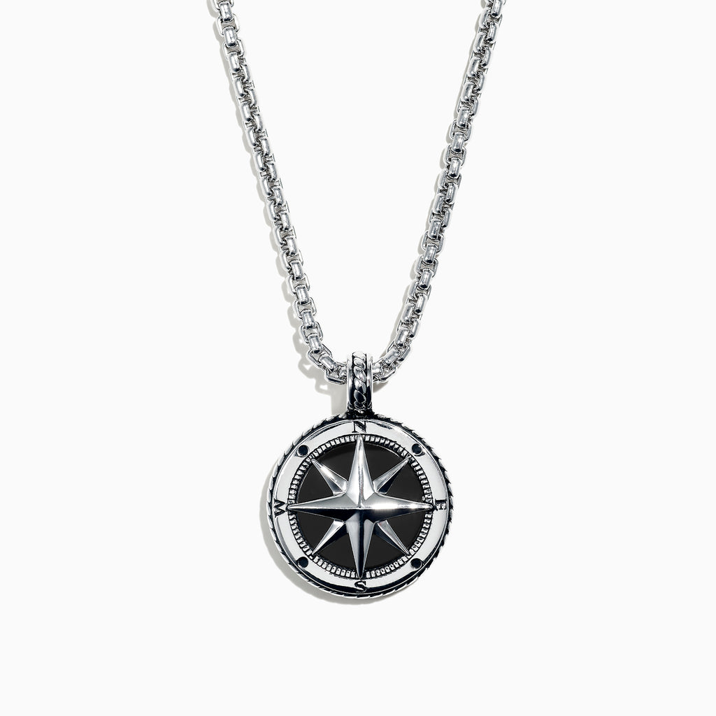 A Mens Sterling Silver Onyx Compass Pendant, 4.00 TCW, featuring a round design is shown on a silver chain and photographed on a white background.