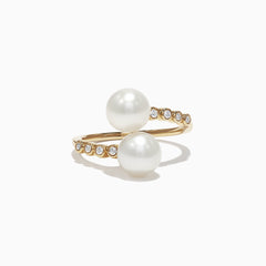 Displayed on a white background, the 14K Yellow Gold Diamond and Fresh Water Pearl Ring (0.09 TCW) features two large white pearls and a row of small round diamonds set along one side of the band.