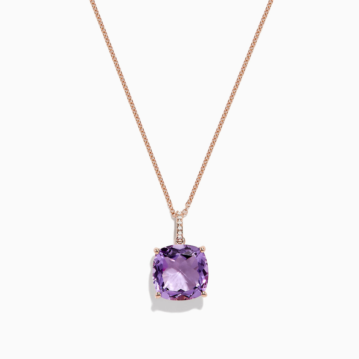The 14K Rose Gold Amethyst and Diamond Pendant, 6.62 TCW, features a cushion-cut amethyst with diamond accents in a four-prong setting and is elegantly displayed on a white background.
