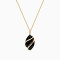 The Eclipse 14K Yellow Gold Onyx and Diamond Pendant (7.08 TCW) features a bold onyx oval wrapped in gold, accented with sparkling diamonds on both the pendant and the chain above it.