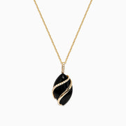 The Eclipse 14K Yellow Gold Onyx and Diamond Pendant (7.08 TCW) features a bold onyx oval wrapped in gold, accented with sparkling diamonds on both the pendant and the chain above it.