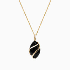 The Eclipse 14K Yellow Gold Onyx and Diamond Pendant (7.08 TCW) features a bold onyx oval wrapped in gold, accented with sparkling diamonds on both the pendant and the chain above it.