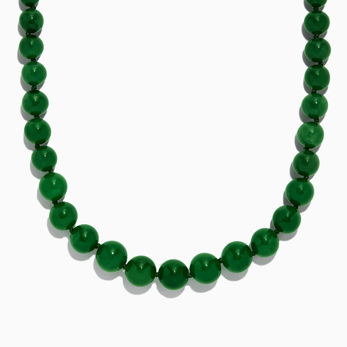 A close-up of a 14K Yellow Gold Jade Necklace, 339.00 TW, arranged in a curved shape against a white background.