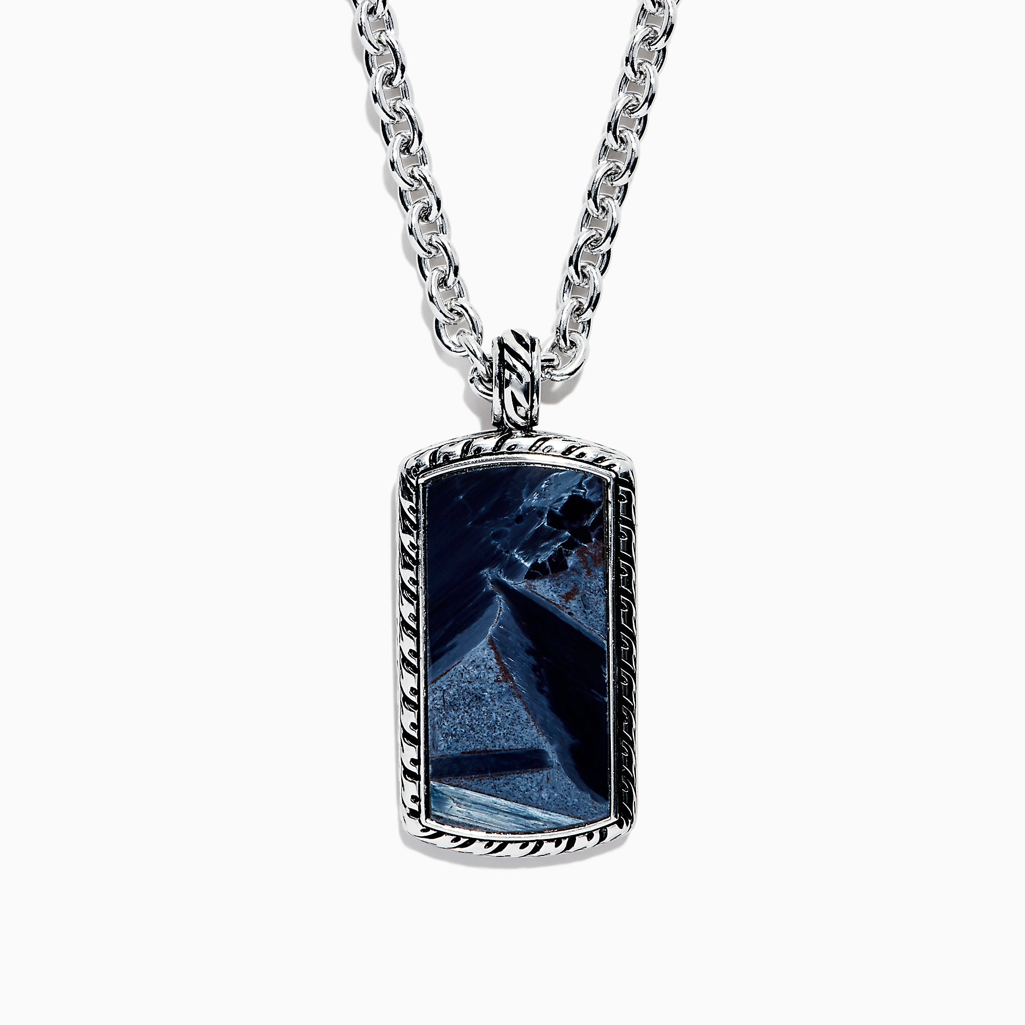 The Mens Sterling Silver Pietersite Dog Tag Pendant, 9.50 TCW, features a rectangular dog tag with a dark blue marbled pietersite stone set in an ornate silver frame on a sterling silver chain.