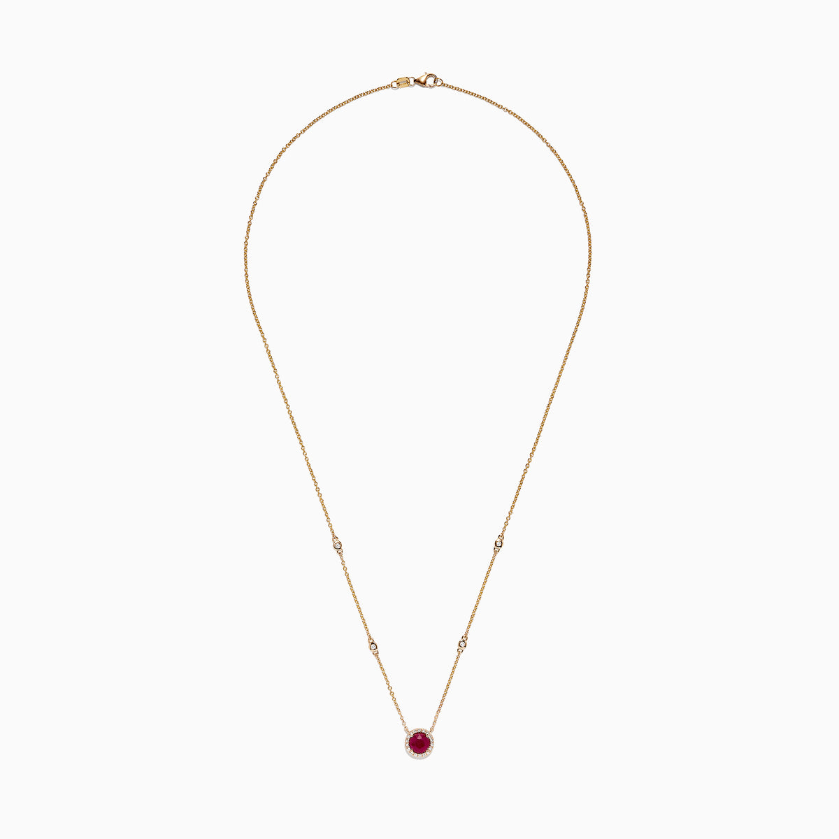 The Ruby Royale 14K Yellow Gold Ruby and Diamond Station Necklace, 1.11 TCW, features a round ruby pendant surrounded by diamonds and additional diamond accents spaced along the chain.