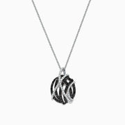 The 14K White Gold Black and White Diamond Pendant (0.92 TCW) showcases interwoven curves with black and white diamonds, creating a modern, elegant look on a delicate silver chain.