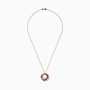 The Ruby Royale 14K Rose Gold Pendant showcases three interlocking ruby and diamond circles (0.66 TCW) on a delicate chain, set against a white background.