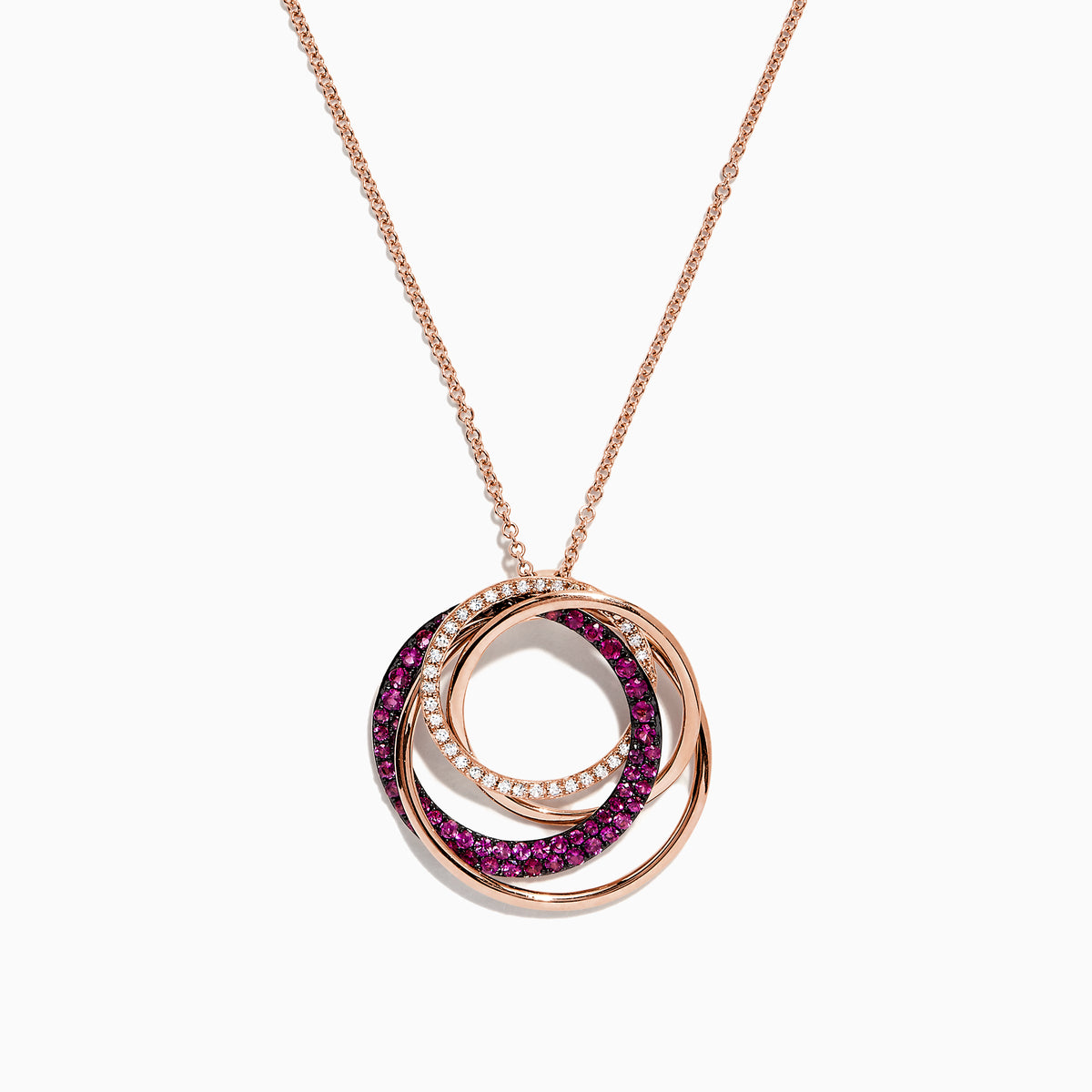 The Ruby Royale 14K Rose Gold Pendant showcases three interlocking ruby and diamond circles (0.66 TCW) on a delicate chain, set against a white background.