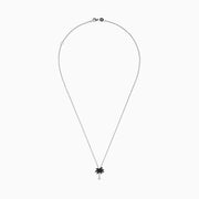A Novelty 14K Gold Palm Tree Pendant with 0.27 TCW black and white diamonds, displayed on a fine chain against a white background.