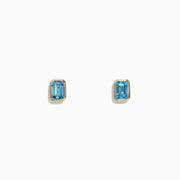 Ocean Bleu 14K Yellow Gold Blue Topaz Stud Earrings, 1.37 TCW by Effy Jewelry are small, rectangular blue topaz studs set in yellow gold, shown against a plain white background.