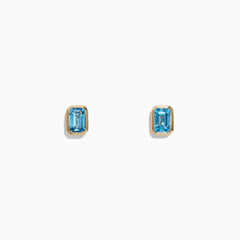 Ocean Bleu 14K Yellow Gold Blue Topaz Stud Earrings, 1.37 TCW by Effy Jewelry are small, rectangular blue topaz studs set in yellow gold, shown against a plain white background.