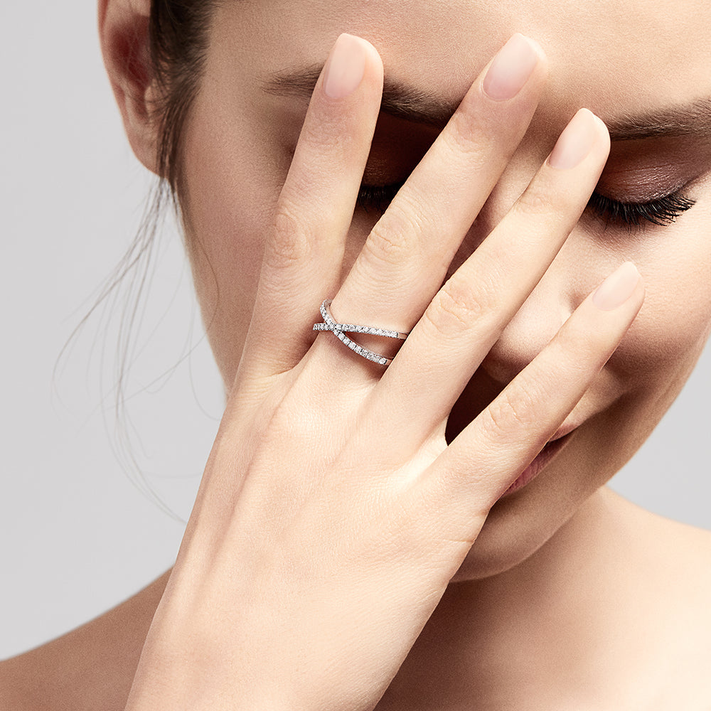 The Pave Classica 14K White Gold Diamond Criss Cross Ring, 0.40 TCW, showcases two intersecting diamond-studded bands for a modern and elegant X-shaped design.