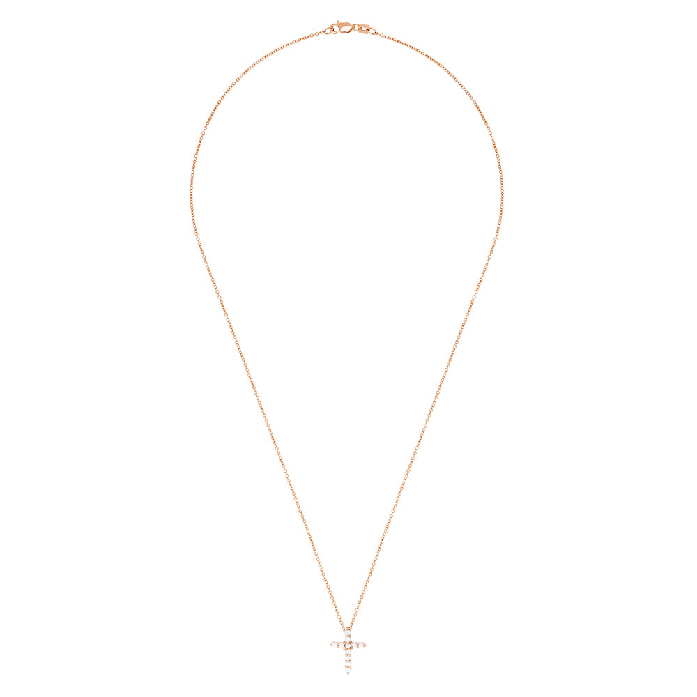 A Pave Rose 14K Gold Diamond Cross Pendant (0.22 TCW) hangs on a fine gold chain, adorned with sparkling diamonds. Shown on a plain white background.
