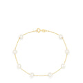 The 14K Yellow Gold Cultured Fresh Water Pearl Station Bracelet features evenly spaced pearls on a delicate gold chain with a small round clasp, shown against a white background.