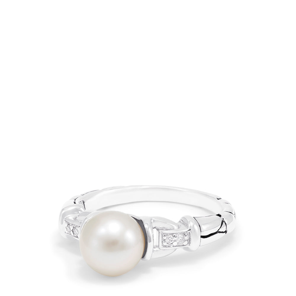 The 925 Sterling Silver Cultured Pearl and Diamond Ring (0.03 TCW) features a round pearl at the center with two small square-set diamonds on each side, displayed against a plain white background.