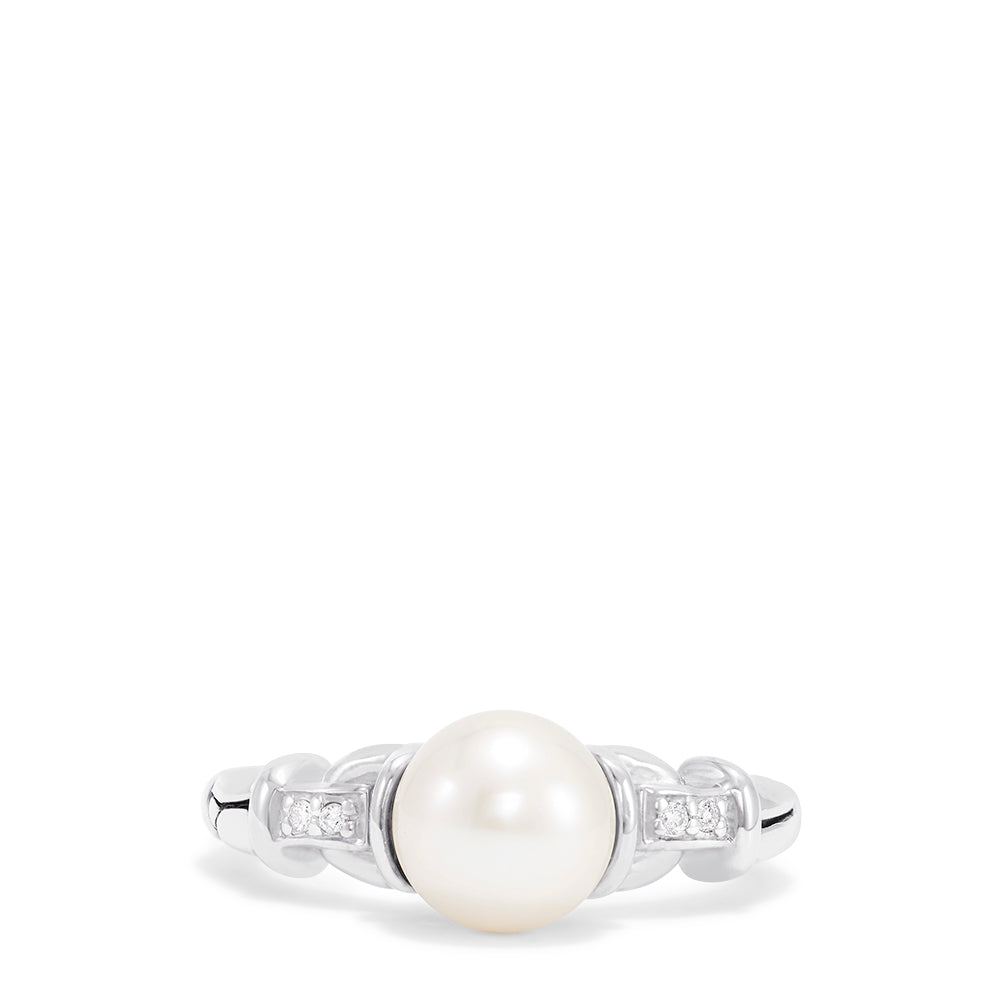 The 925 Sterling Silver Cultured Pearl and Diamond Ring (0.03 TCW) features a round pearl at the center with two small square-set diamonds on each side, displayed against a plain white background.
