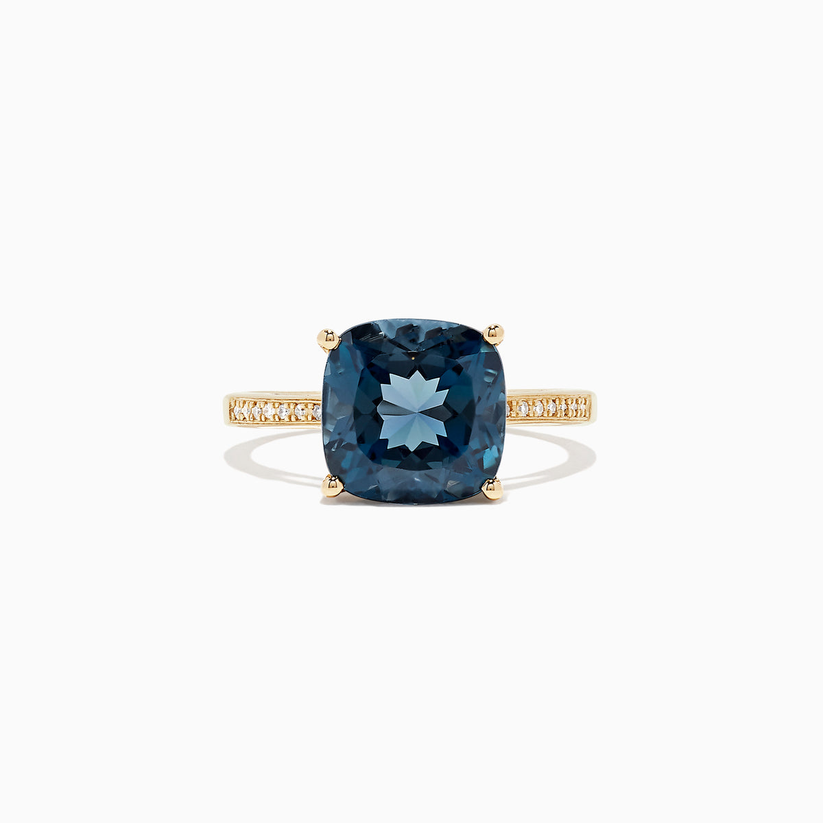 The Ocean Bleu 14K yellow gold ring boasts a cushion-cut London Blue Topaz centerpiece and sparkling round diamonds along the band, totaling 4.54 TCW.