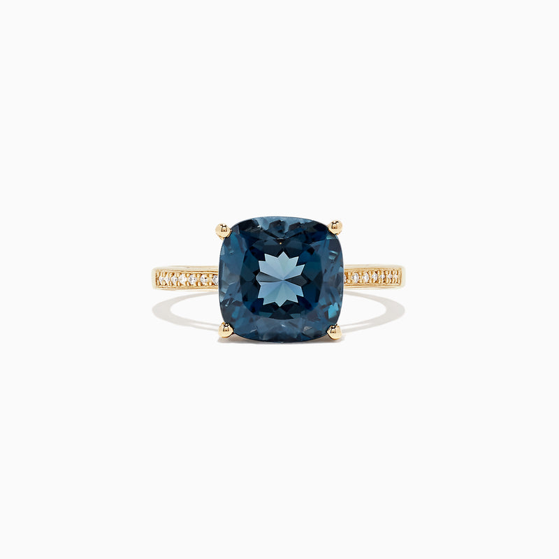 The Ocean Bleu 14K yellow gold ring boasts a cushion-cut London Blue Topaz centerpiece and sparkling round diamonds along the band, totaling 4.54 TCW.