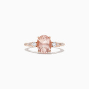 The Blush 14K Rose Gold Morganite and Diamond Ring, 2.64 TCW, features an oval morganite center with two white diamonds on a detailed band, shown on a white background.