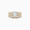 The Bouquet 14K Yellow Gold Channel Set Diamond Engagement & Wedding Ring Set, 1.48 TCW, features a brilliant diamond center and two matching diamond bands—an elegant choice for your special day.