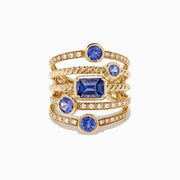 The Nahla Siri 14K Yellow Gold Tanzanite and Diamond Ring, 2.26 TCW, features five uniquely shaped blue tanzanites and shimmering round diamonds set along the multi-band design for extra sparkle.