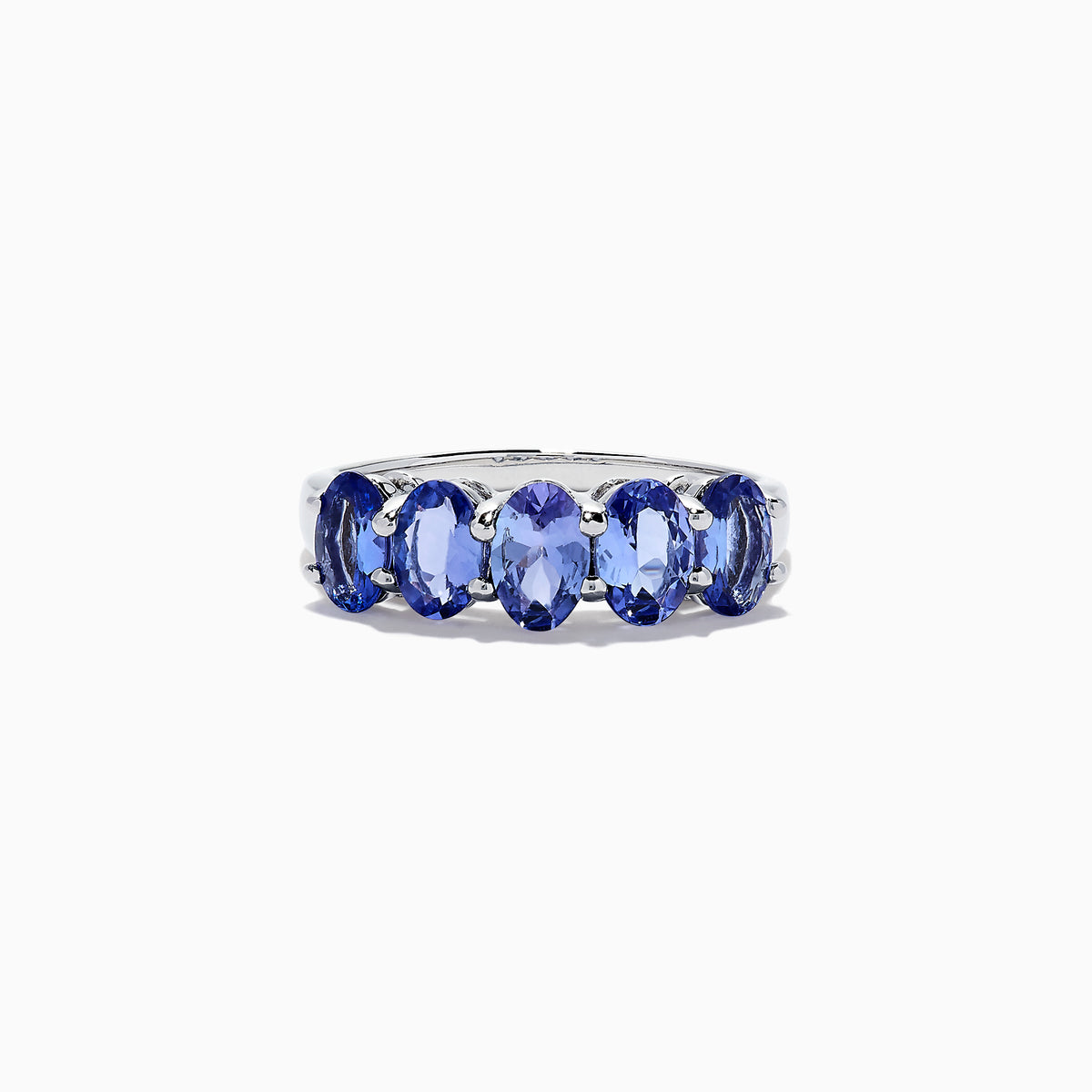 The Nahla Siri Sterling Silver Tanzanite Band Ring, 2.14 TCW, features five oval tanzanite gemstones in a row, each secured by four prongs and showcased against a white background.