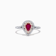 The Ruby Royale 14K Two Tone Gold Ring features a pear-shaped ruby at the center, surrounded by two halos of sparkling diamonds (0.77 TCW), elegantly set and displayed on a plain white background.
